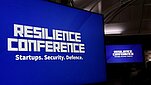 Text "Resilience conference" on blue background.