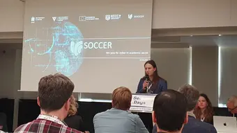 Group of people watching presentation