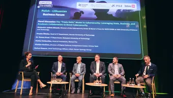 Six people talking on stage.