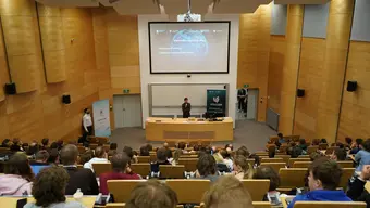 Lecture room filled with people.